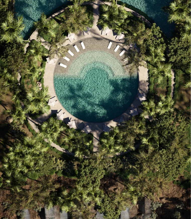 Aerial view of Magnifica luxury resort pool surrounded by palm trees and lounge seating